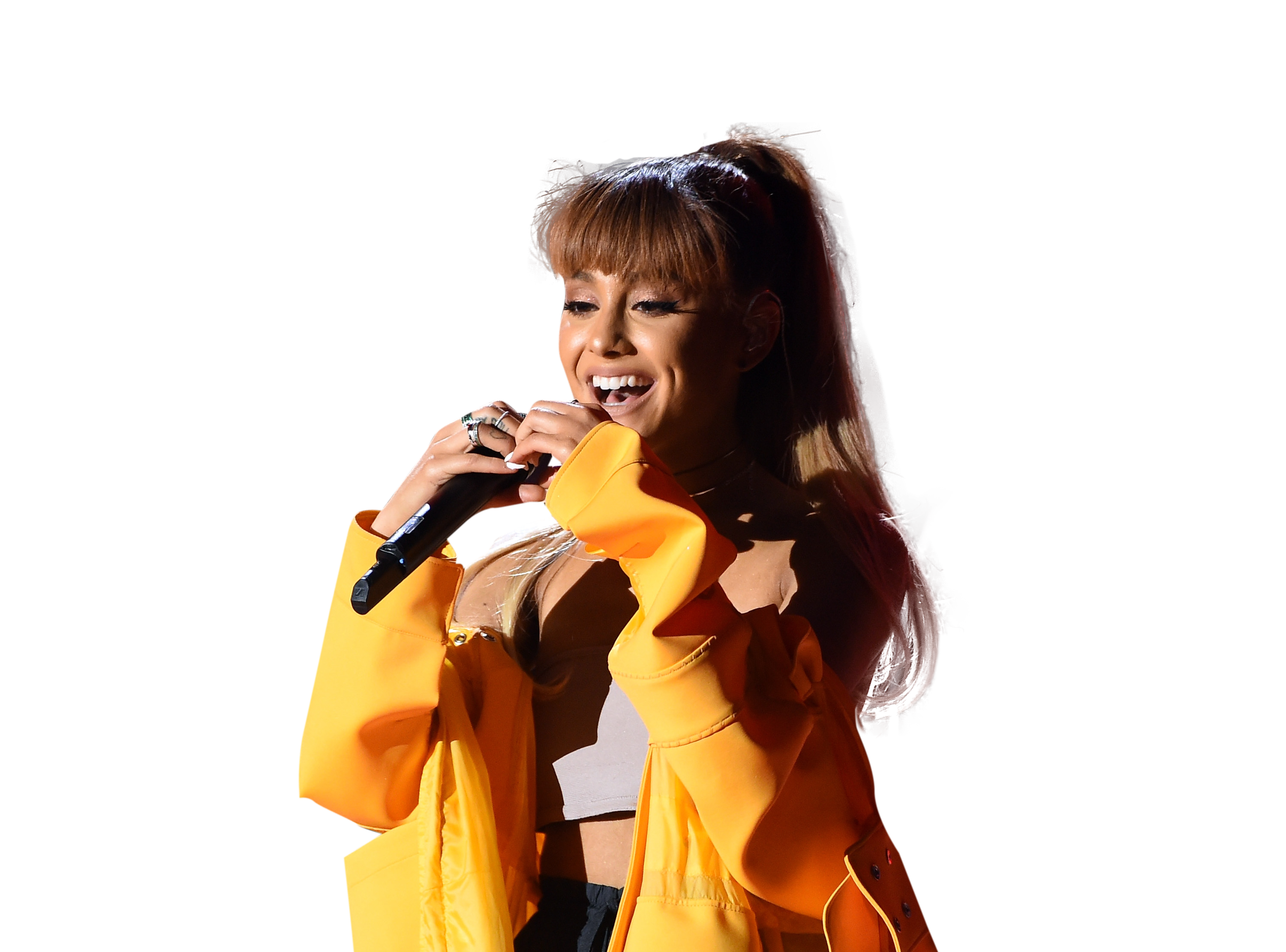 Ariana Grande in yellow dress on stage PNG Image
