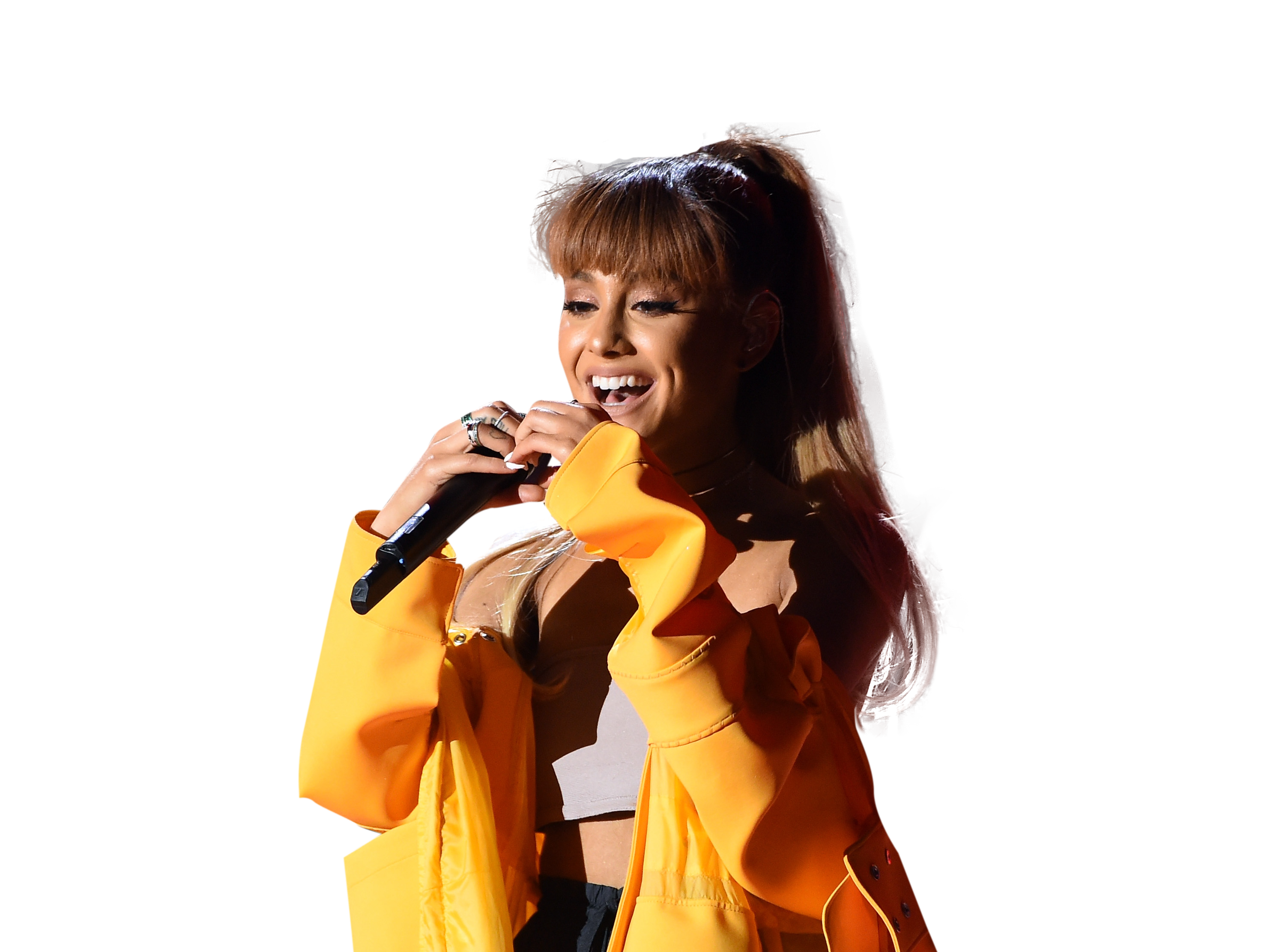 Ariana Grande in yellow dress on stage