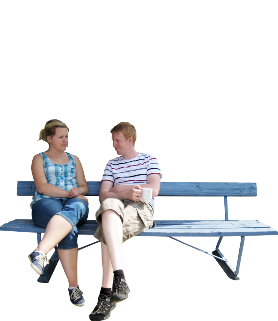 people sitting on a park bench