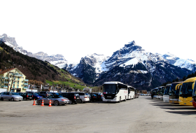 Parked Buses and Cars by the Alps